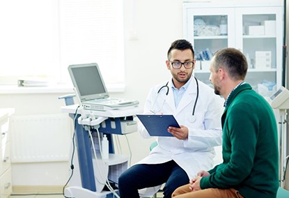 Patient and doctor talking during medical consultation