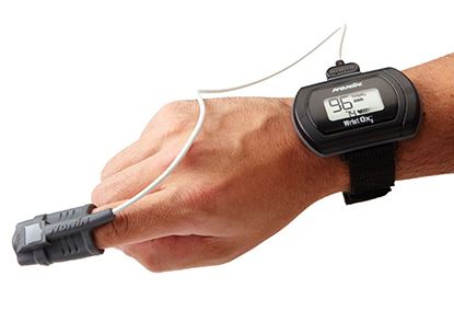 Hand with a sleep apnea screening device in place